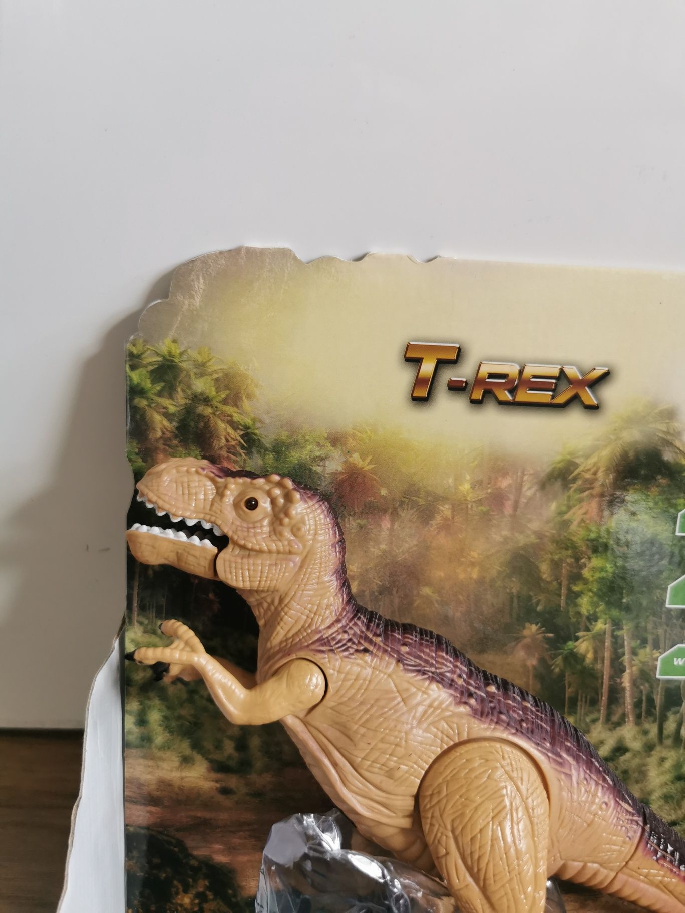 Dinozaur T-Rex zabawka dźwięki światło rusza ręką ryczy