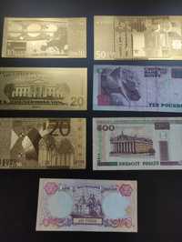 Банкноти різних країн та золоті евро з доларами