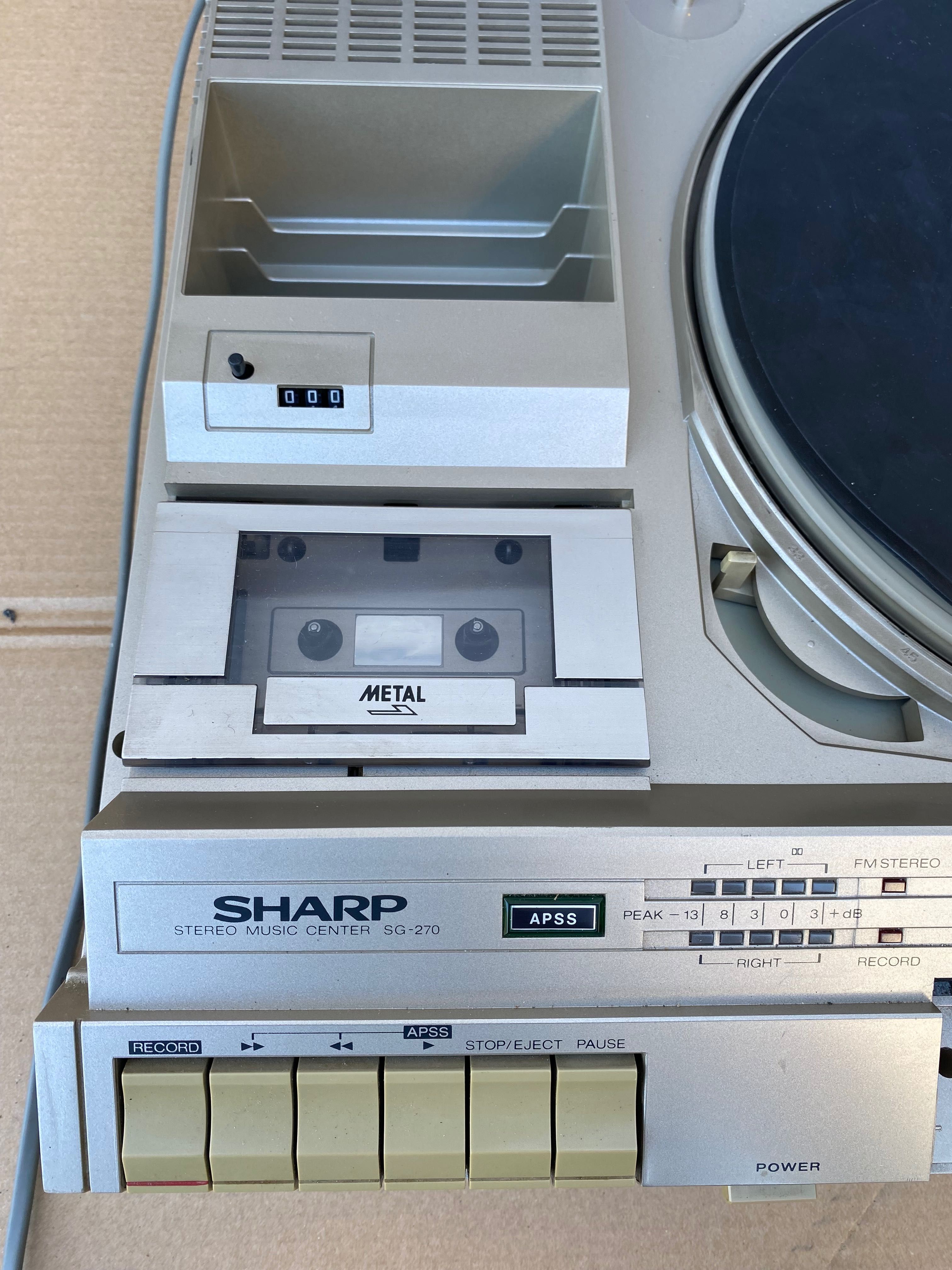 Gira discos Sharp stereo music center Sg-270
