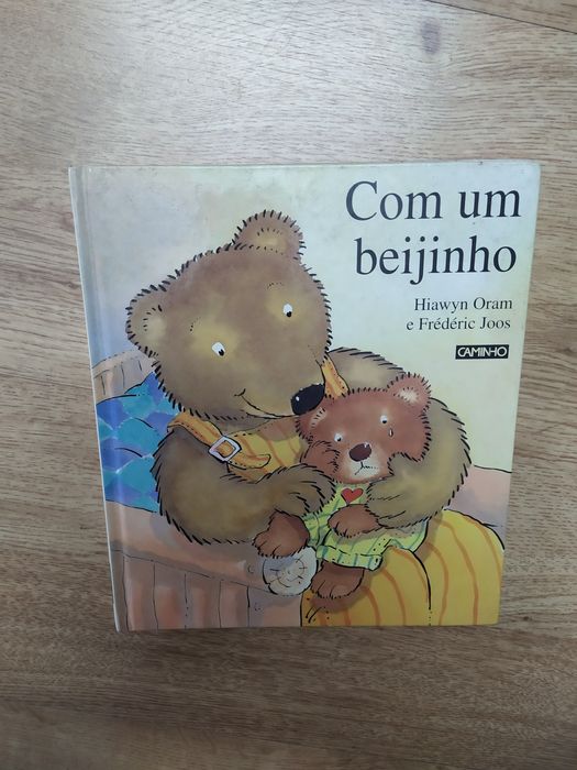 Vendo o livro- Com um beijinho, de Hiawyn Oram e Frédéric Joos