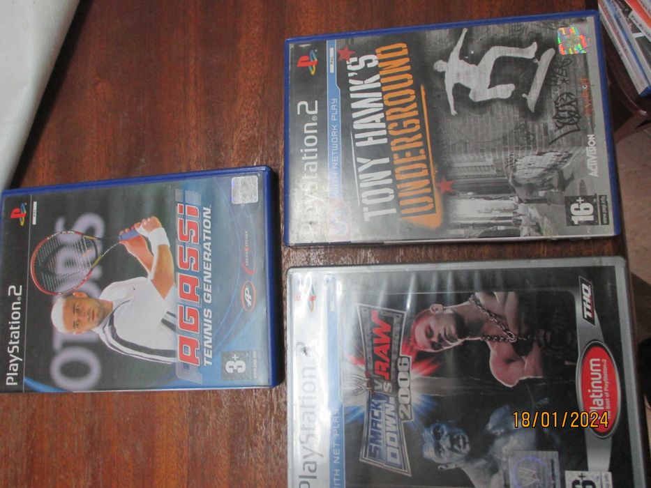 3 jogos para Playstatio 2 - Smack down vs raw, Tony Hawk's e Agassi