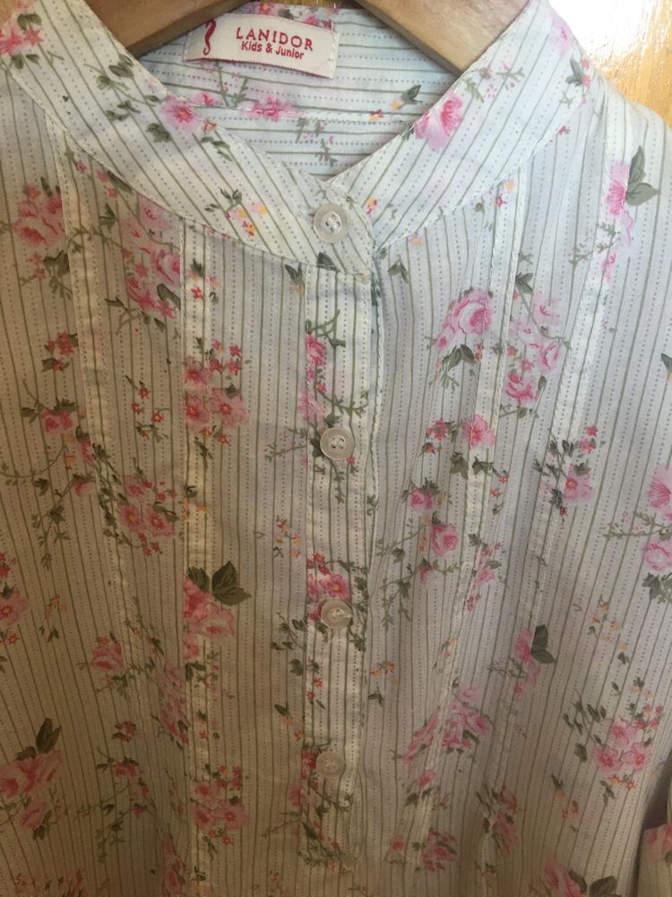 Camisa/blusa com flores e riscas, tamanho 10-11 da marca Lanidor.