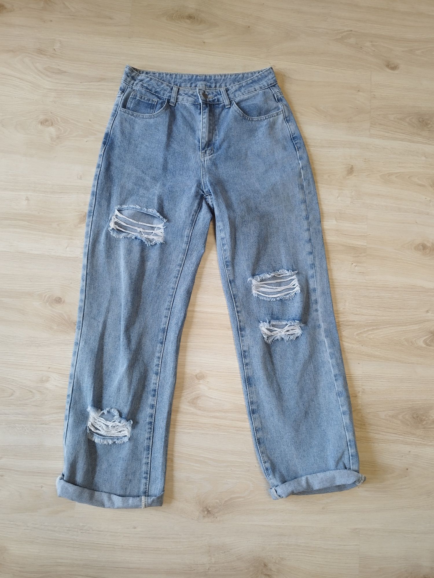 Spodnie jeansy damskie z rozdarciami