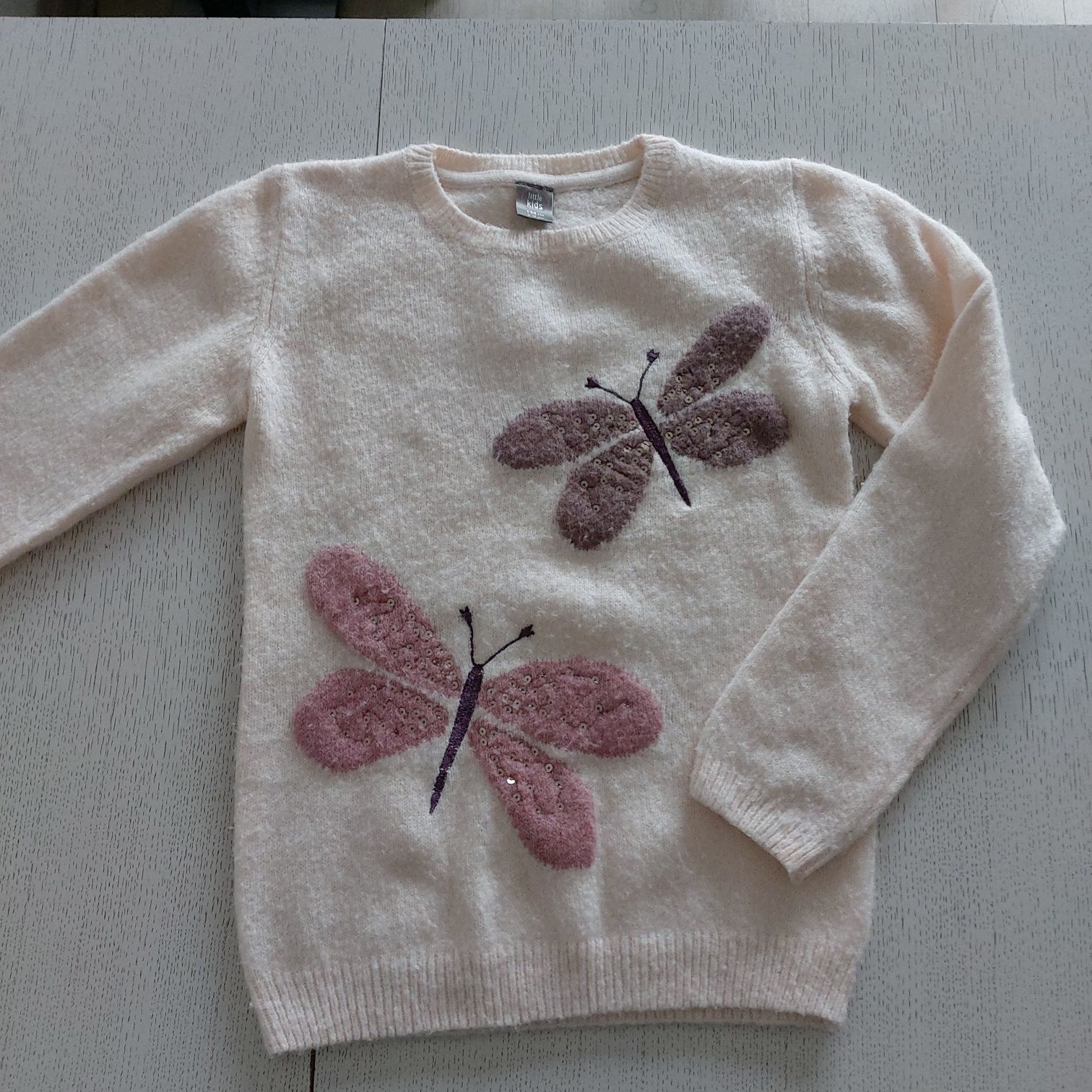 Sweterek z motylkami rozm. 134
