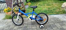 Rower btwin z bocznymi kołami
