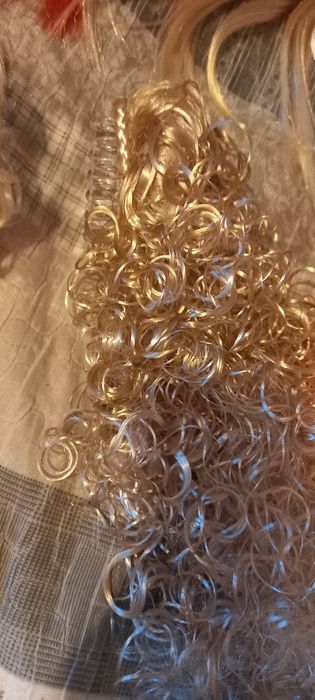 Штучне волосся на заколках та резинках