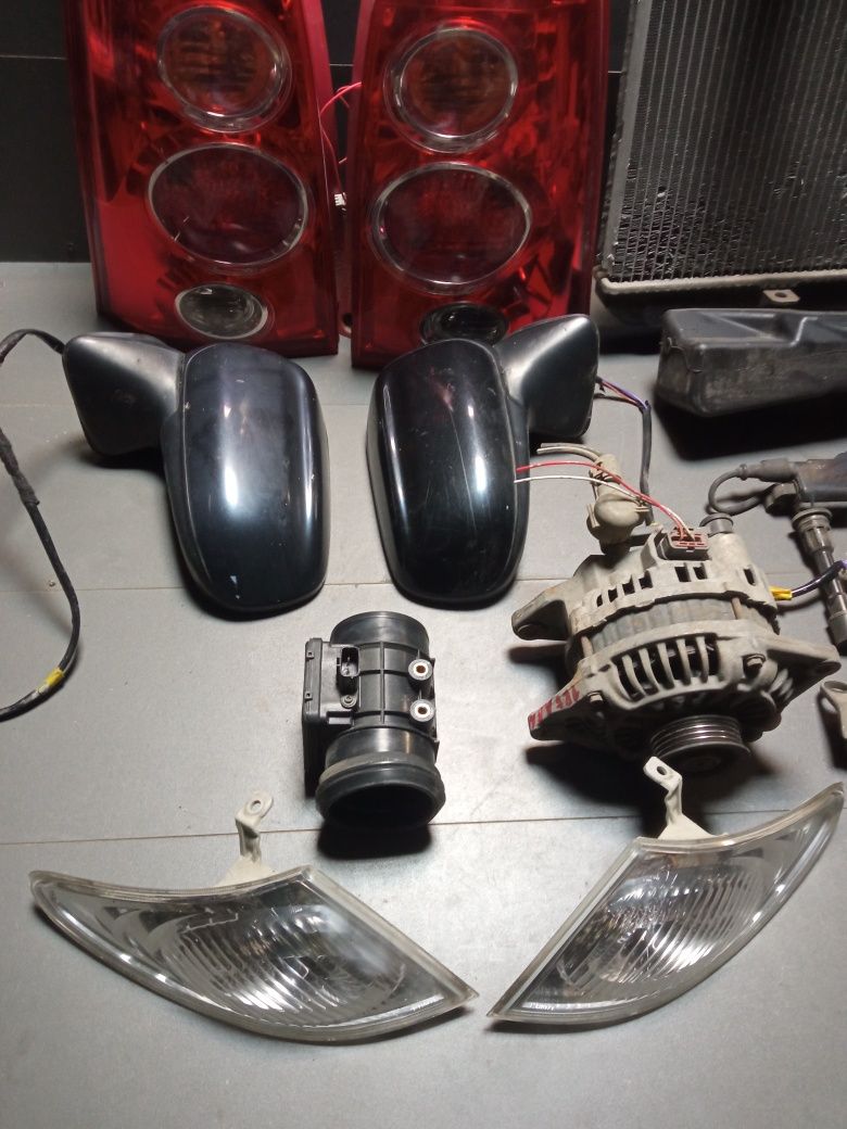 Mazda Premacy 1.8 alternator chłodnica lampy cewka roleta kierunki
