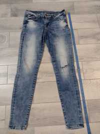 Spodnie jeansowe damskie z modnymi przetarciami rozmiar 38