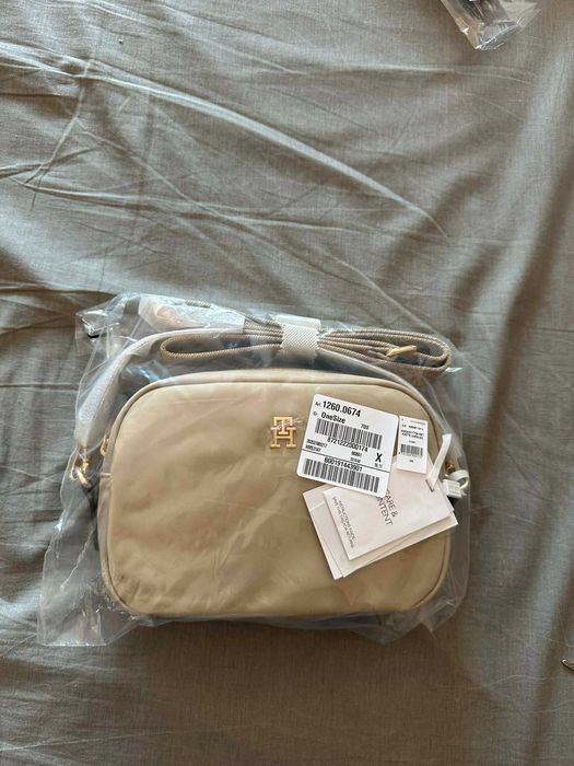 mala tommy nova e original