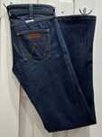 Boot jeans dzwony ze średnim stanem from Wrangler