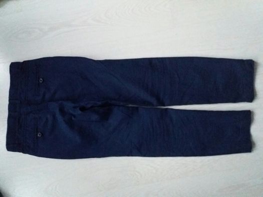 Eleganckie spodnie Coccodrillo granatowe jak nowe 134 cm
