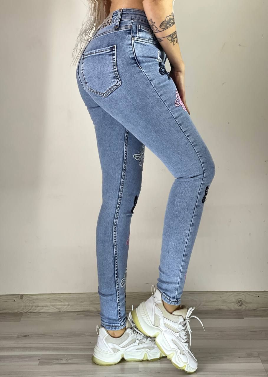 Spodnie jeans damskie w motyle S-XL