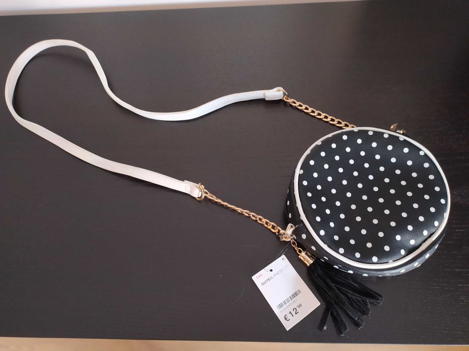 Mala nova preta com bolinhas brancas