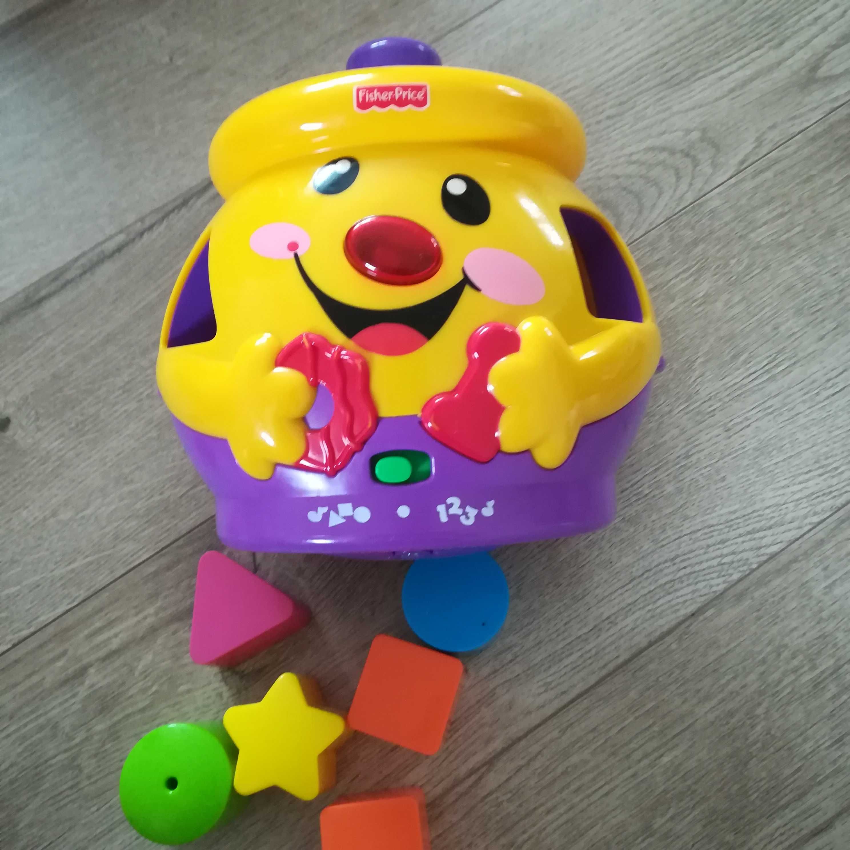 Garnuszek na klocuszek Fisher price