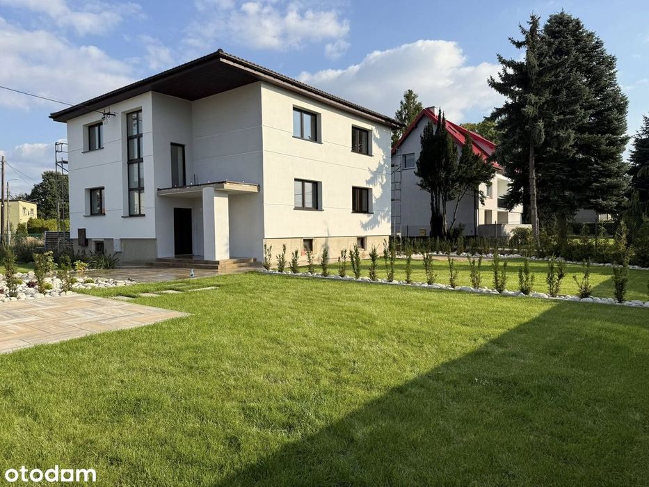 Nowoczesne mieszkanie z ogródkiem i sutereną – Chełm Śląski