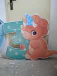 Placas decorativas festas dinossauros em PVC auveuolar