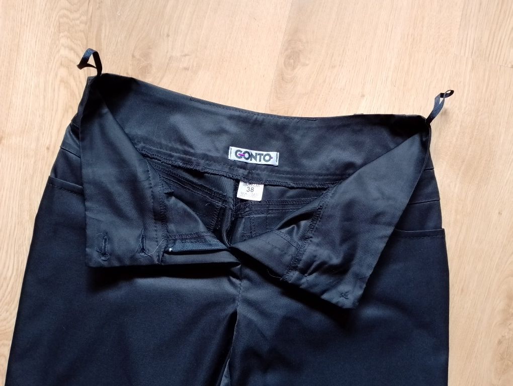 Spodnie czarne z połyskiem eleganckie r. 38 M jak nowe