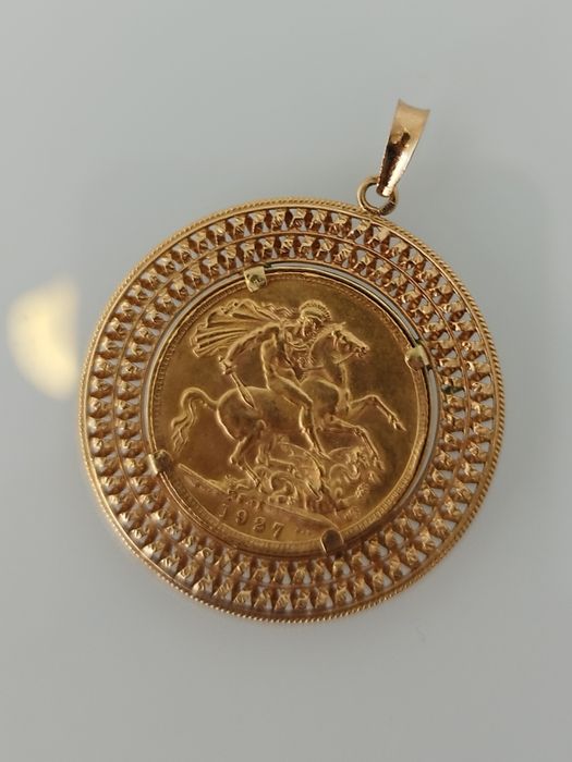 Medalha libra em ouro de 22kt com aro de 19,2kt