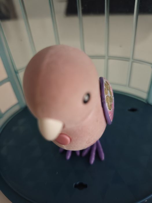 Brinquedo pássaro com gaiola