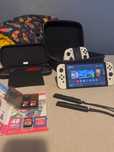 Nintendo Switch OLED + dodatki (gry, karty, akcesoria)