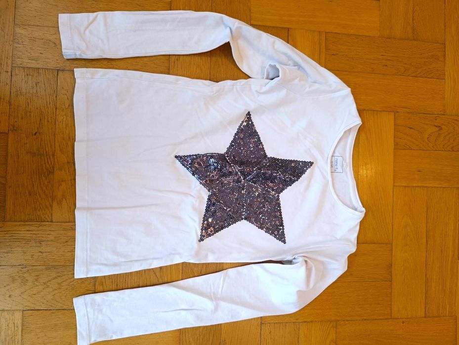Bluzka biała z dużą gwiazdą z cekinów, r. 146-152