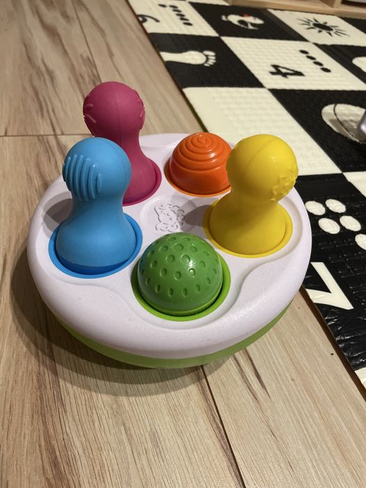 Sorter Kolorowe Wańki Wstańki SpinnyPins Kręgle Fat Brain Toy