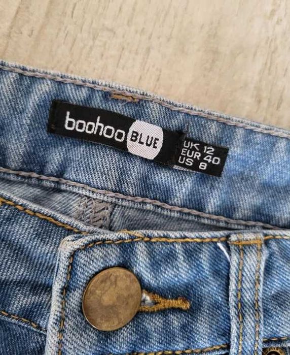 Spodnie z wysokim stanem spodnie z przetarciami 38