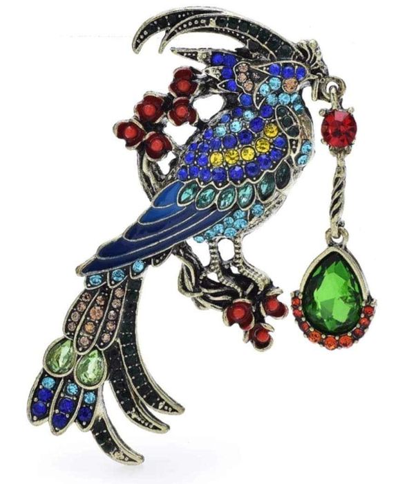 Przepiękna broszka, wielobarwny ptak z ozdobą.
