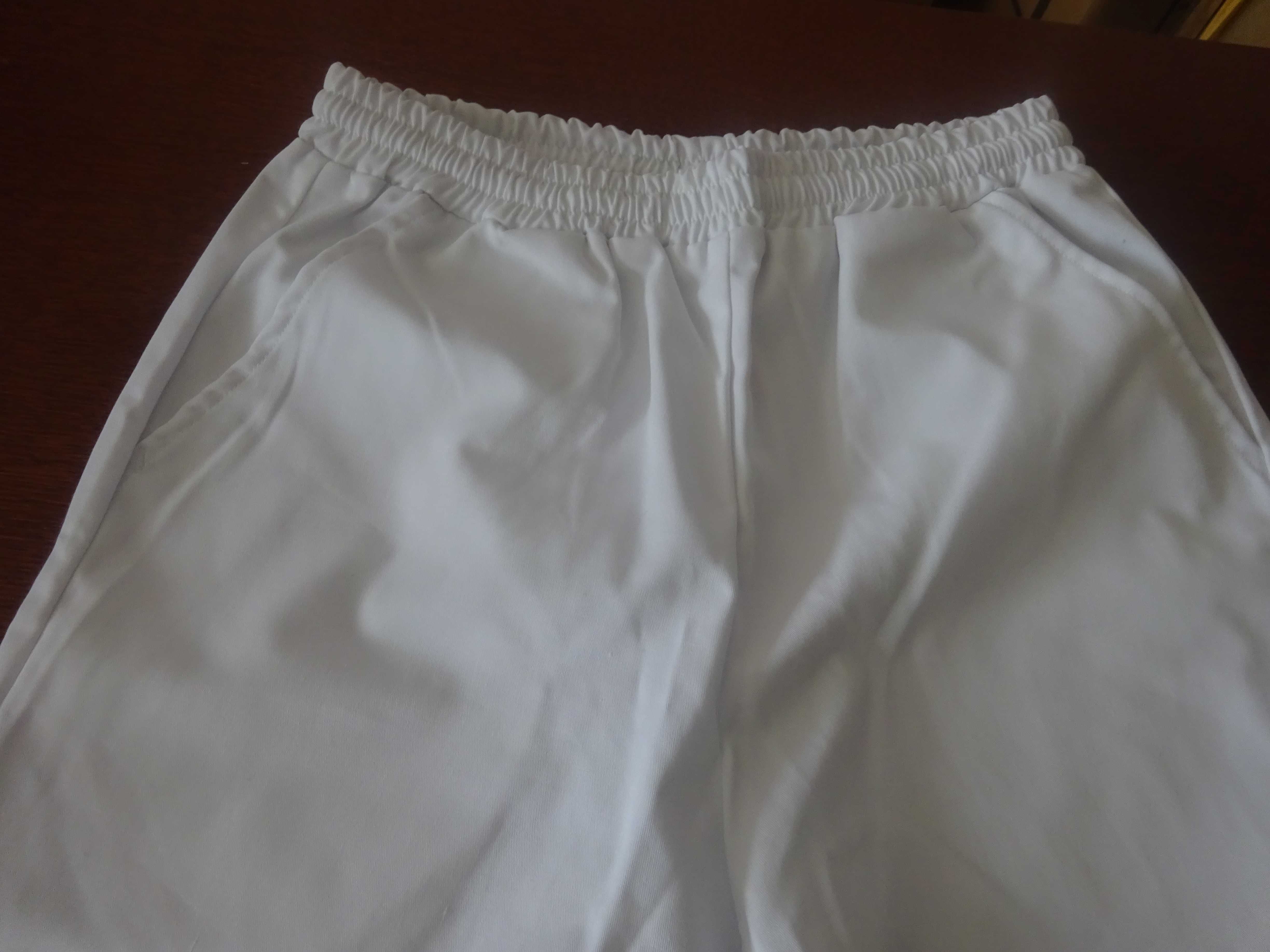 M L białe spodnie medyczne damskie męskie na gumkę pas max. 80 cm