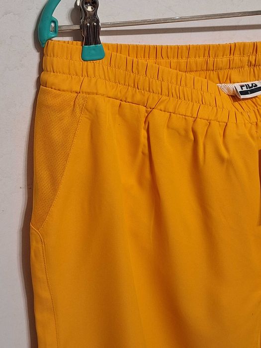 Нові жовті шорти Fila