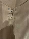 Vestido tipo coboy com franjas nos bracos