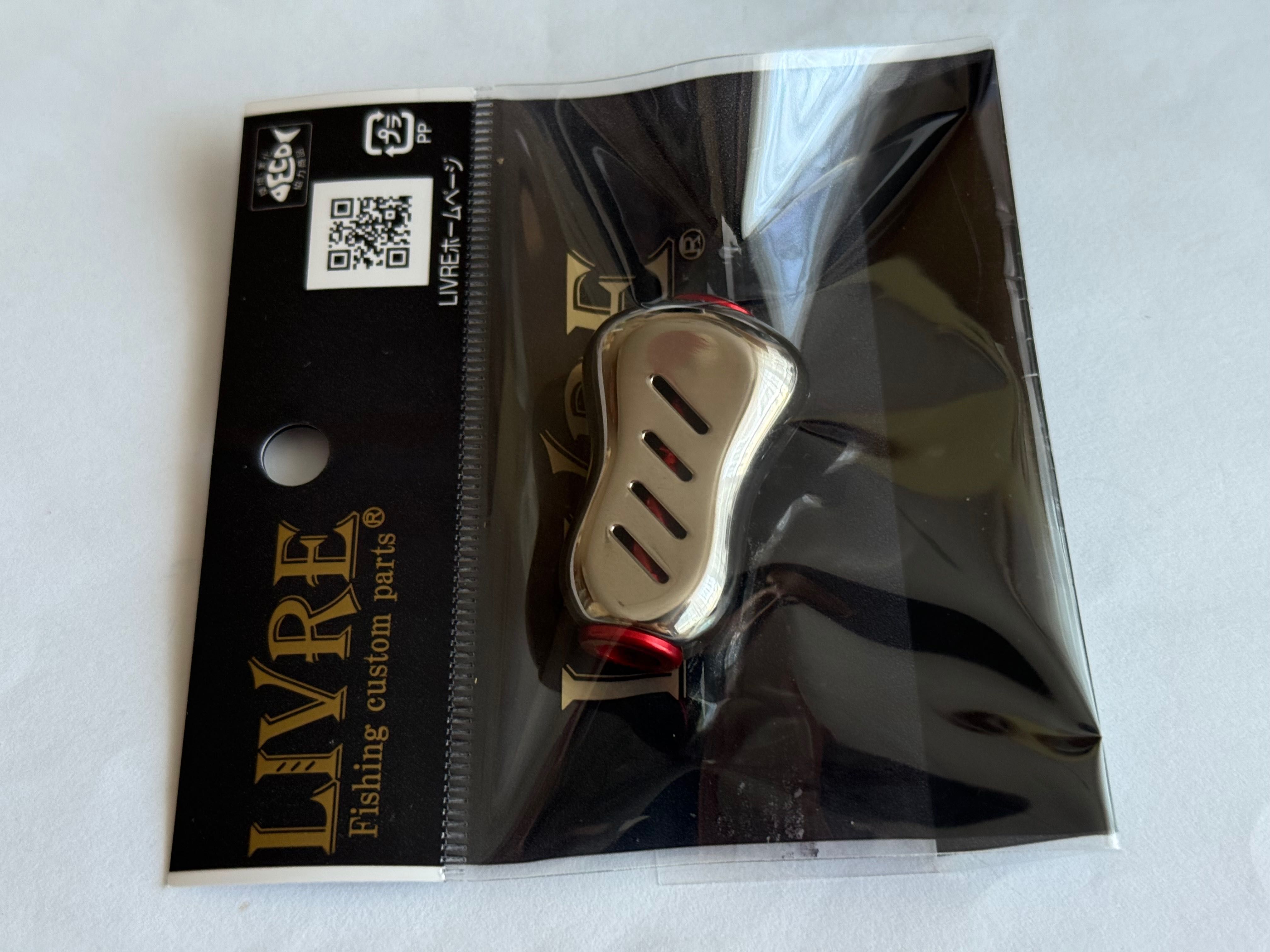 NOWY-Knob LIVRE FINO PLUS Titanium do wszystkich koł. Shimano i Daiwa
