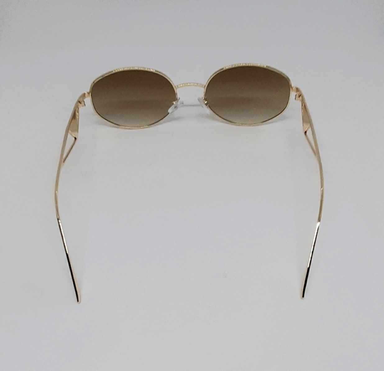 Женские брендовые солнцезащ очки овальные коричневые в золотом металле