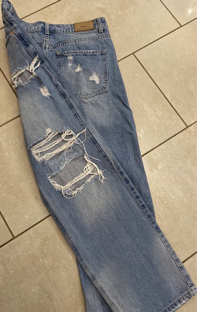Damskie jeans, extra szerokie spodnie New Yorker  r. L/40 dziury