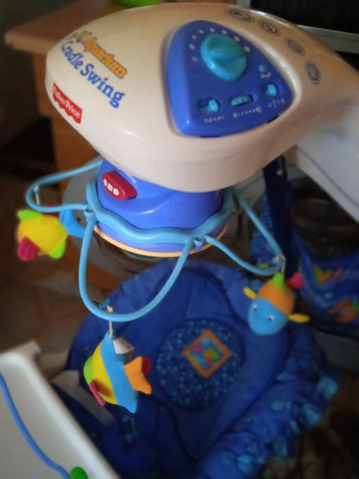 Заколисуючий центр, гойдалка дитяча