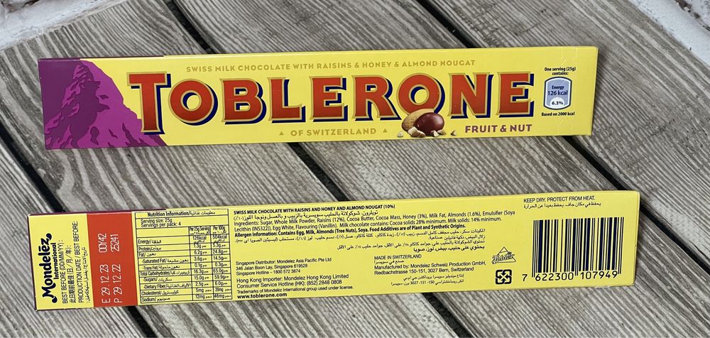 Шоколад Тоблерон Toblerone 100 грам  Молочний з родзинками