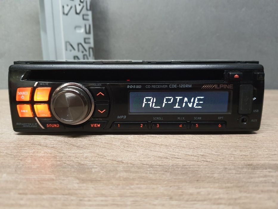 Radio samochodowe Alpine CDE-120RM CD MP3, USB, AUX / RCA pomarańczowy