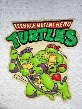 Cartaz publicitárias em alto relevo das tartarugas ninja.