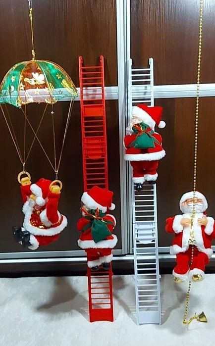 Новорічна іграшка музичний Санта на драбині , на мотузці, з парашутом