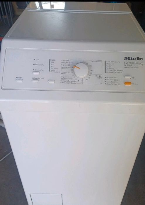 Вертикальна пральна машина Miele