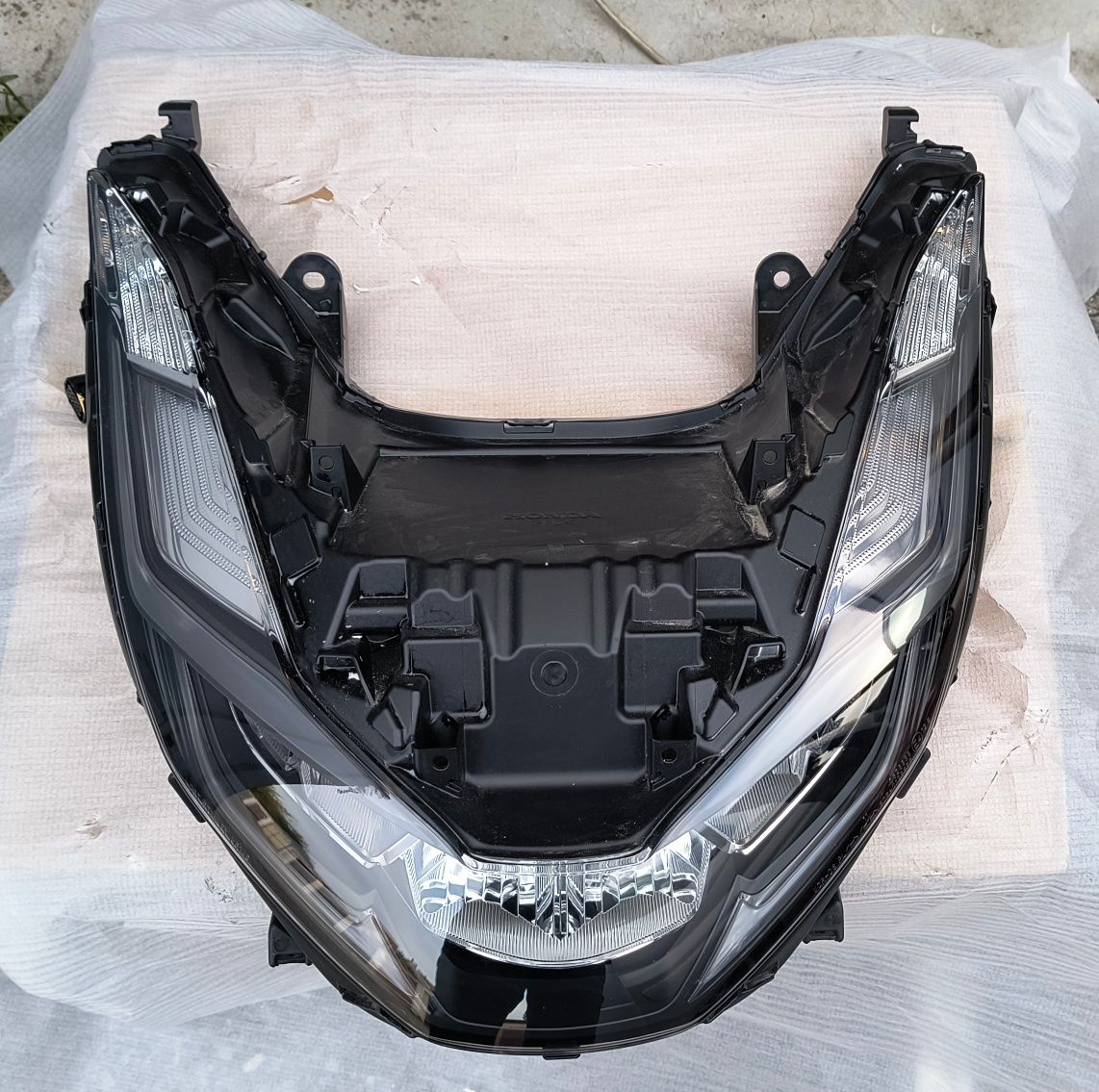 Reflektor PCX przedni