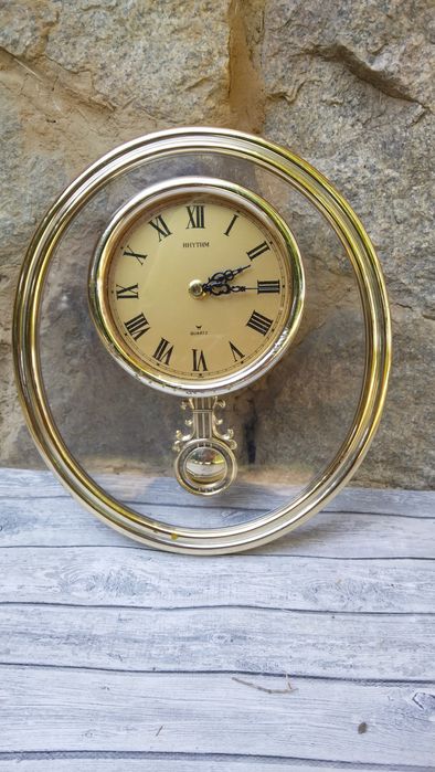 Rhythm часы настенные с маятником.