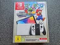 Nintendo Switch Oled wersja Mario Wonder komplet + futerał