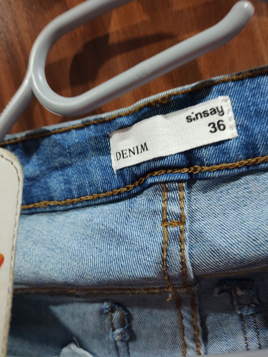 Spodnie damskie jeansy poszarpania Sinsay S36