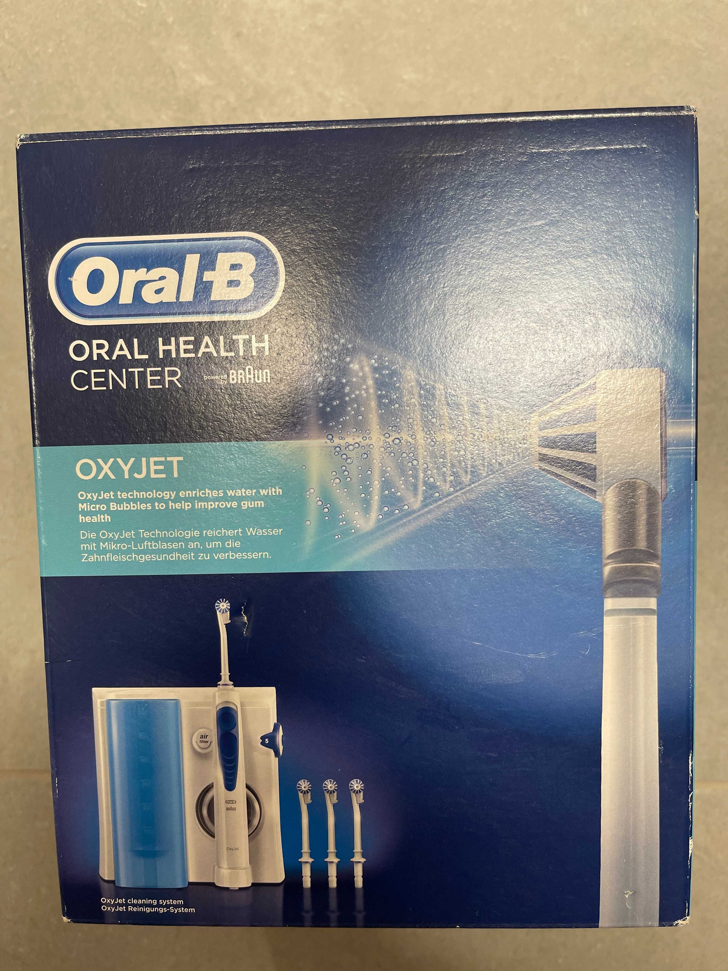 Oral-B irygator stacjonarny + elektryczna szczoteczka + końcówki !!
