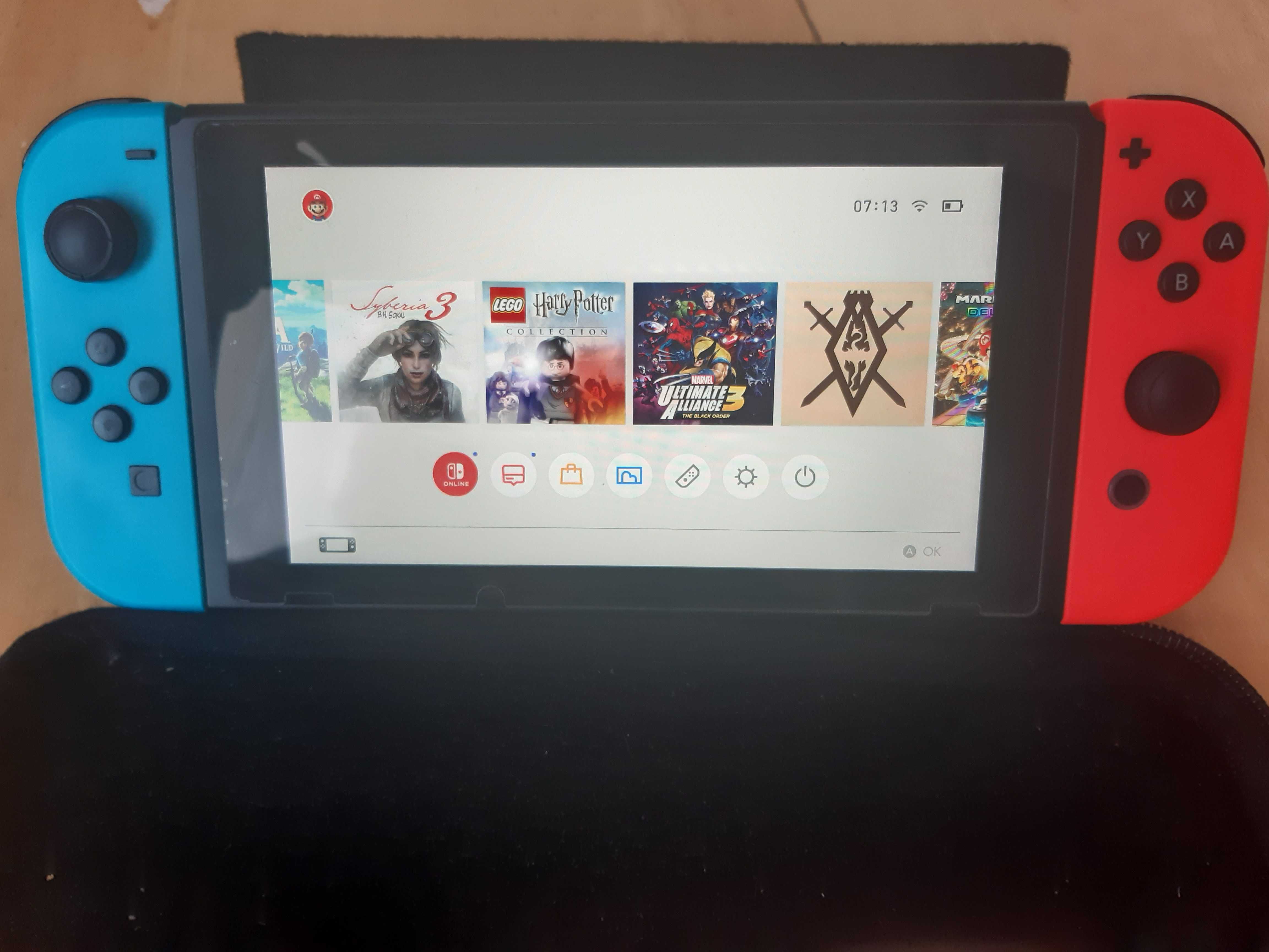 Nintendo Switch в ідеальному стані + 4 гри