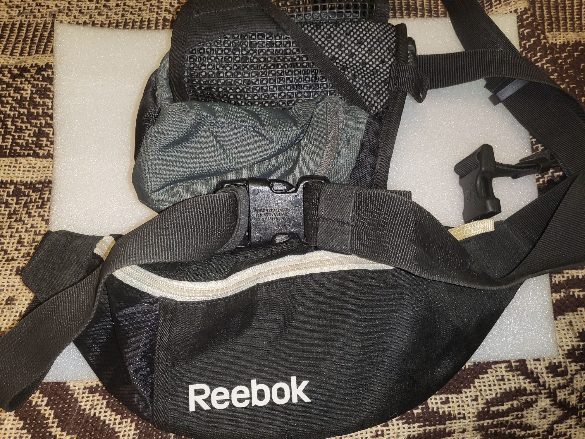 Szaszetki sportowe Reebok i Deuter