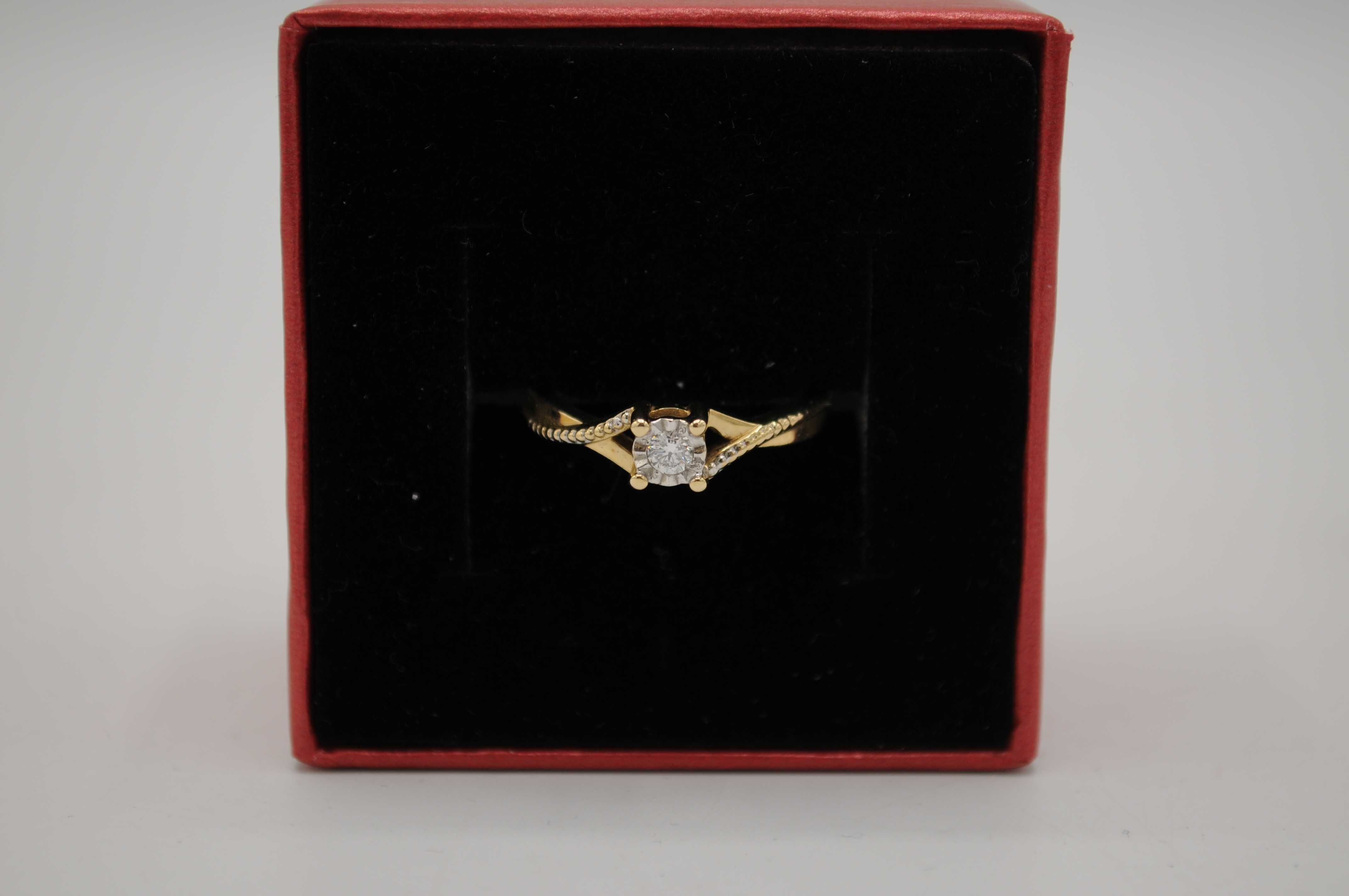 Złoty pierścionek z brylantem 0,08 ct wyrób jubilerski 585 - 2,24 g.