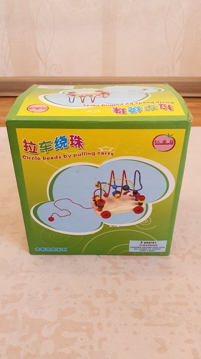 іграшка каталка-головоломка