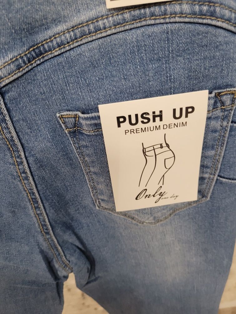 Nowe z metką spodnie jeansowe jeansy z serduszkami Push up L